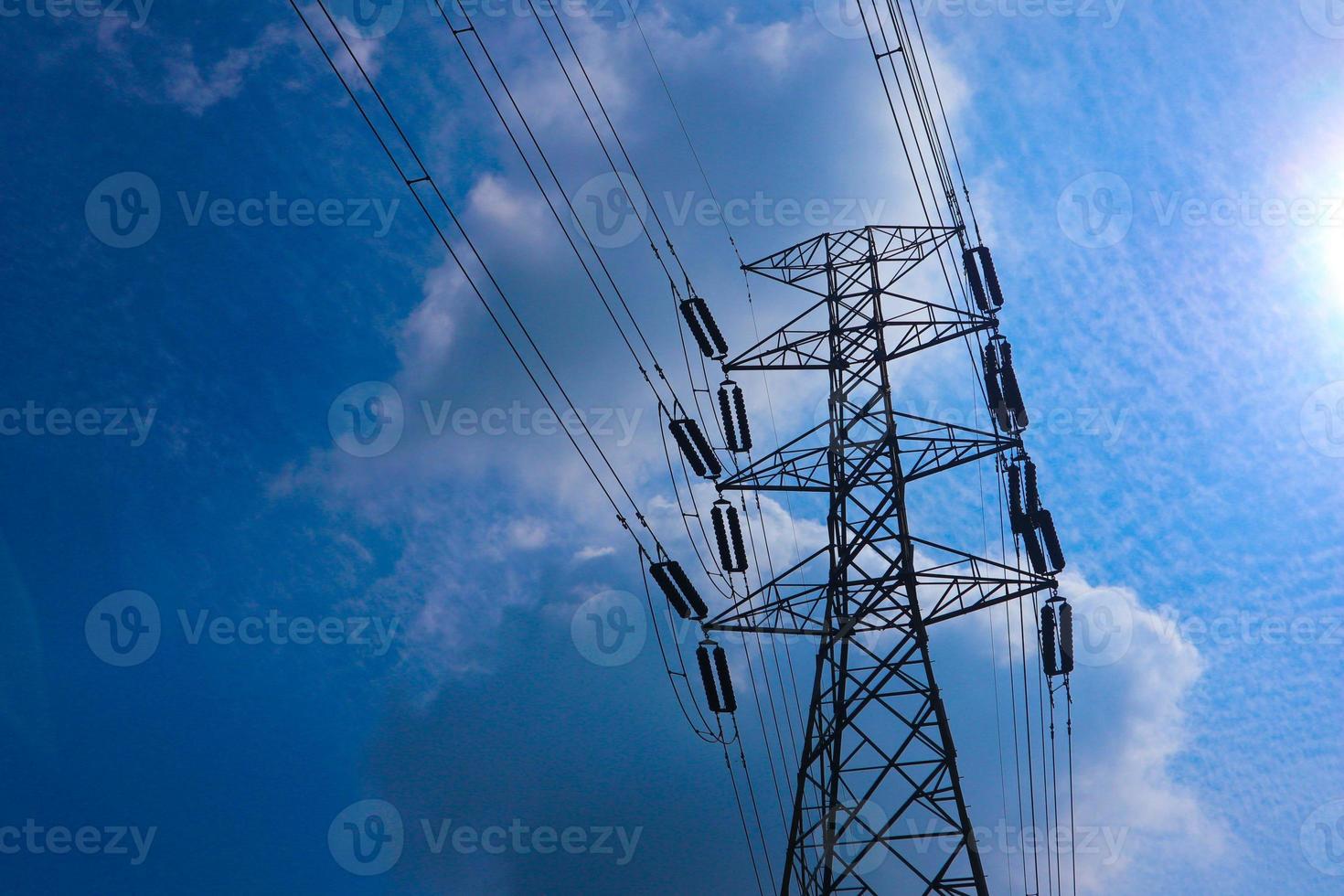 the pylon outline, Very High Voltage Power Lines Indonesia SUTET on blue sky photo