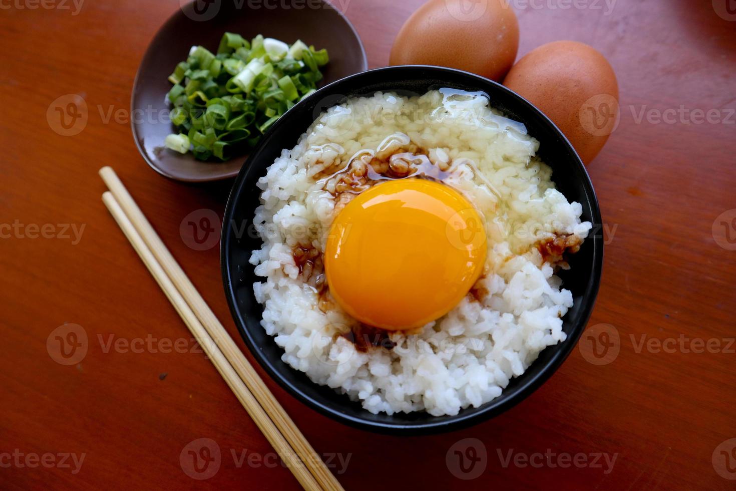 tamago kake gohan or raw egg on rice. traditional food from japan, eat on breakfast photo