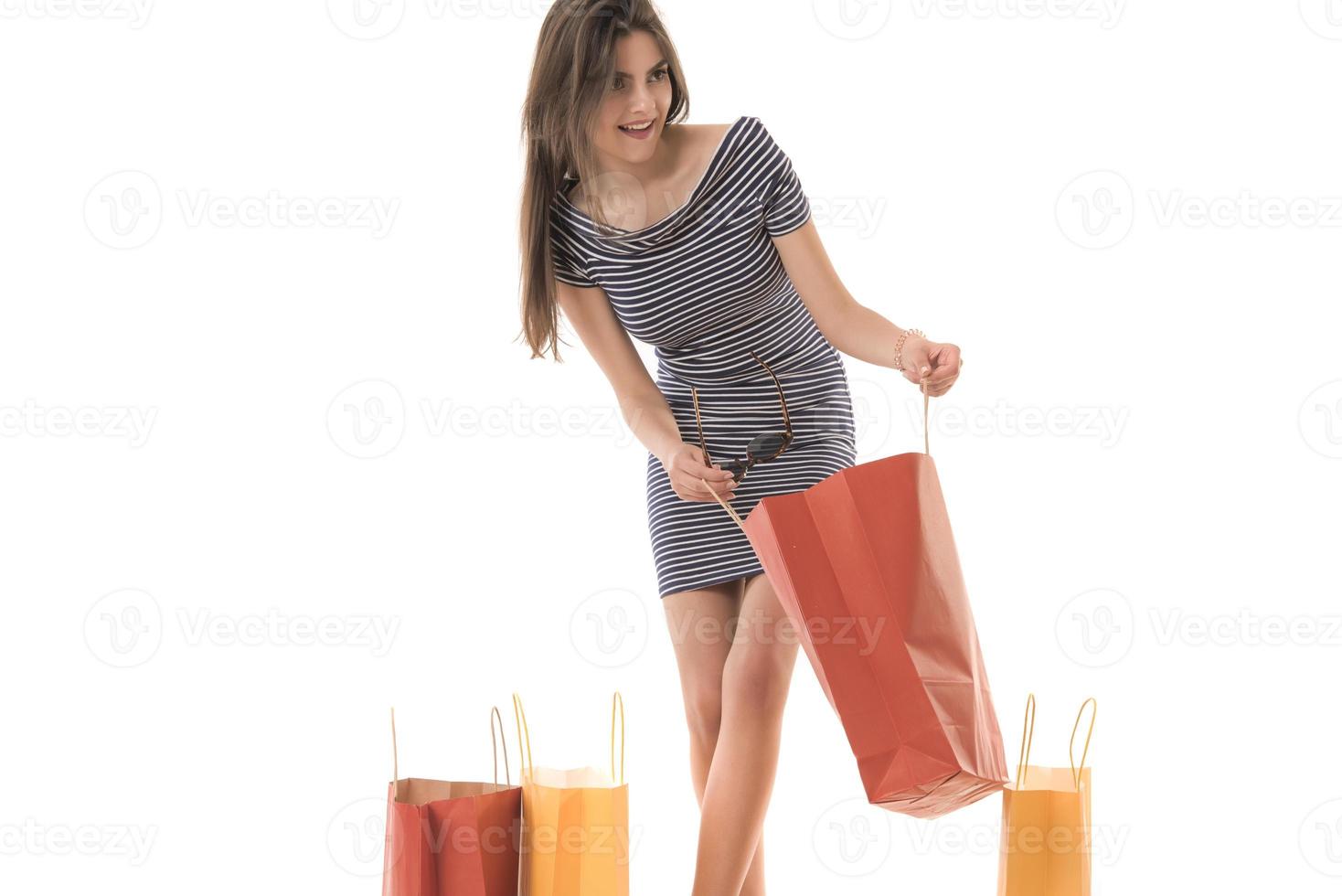 Young Modern Beautiful woman with a lot of shopping bags photo