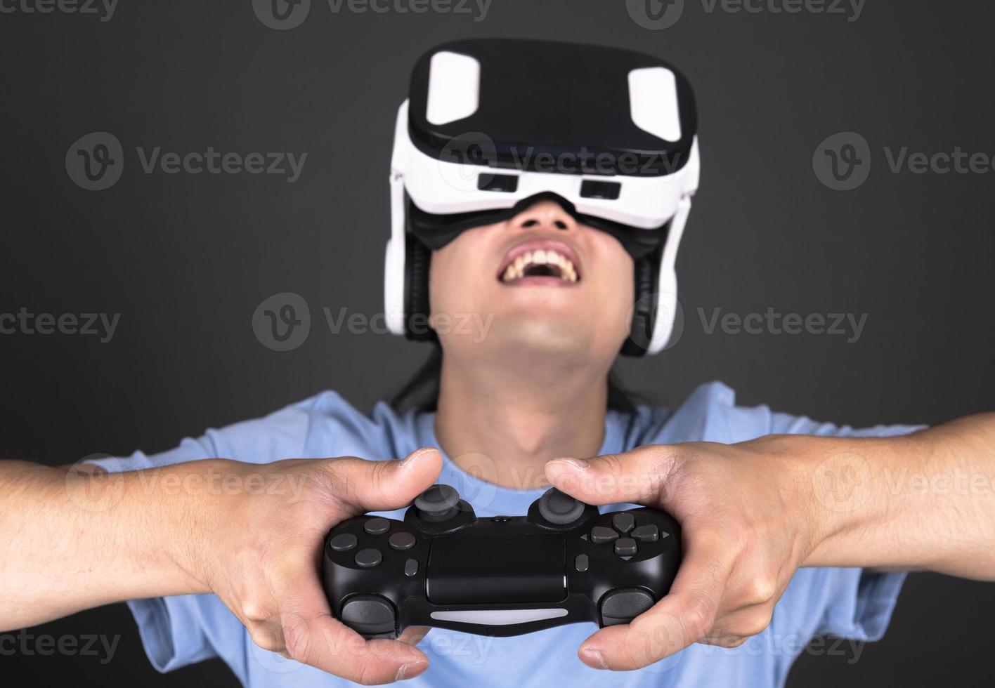 Concept of digital screen, connection and interfaces. Attractive man enjoying virtual reality glasses. photo