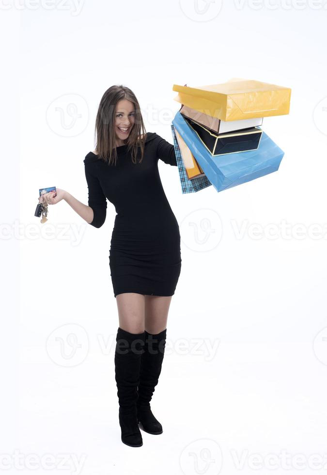 Shopping concept. Beautiful smiling brunette with shopping bags photo