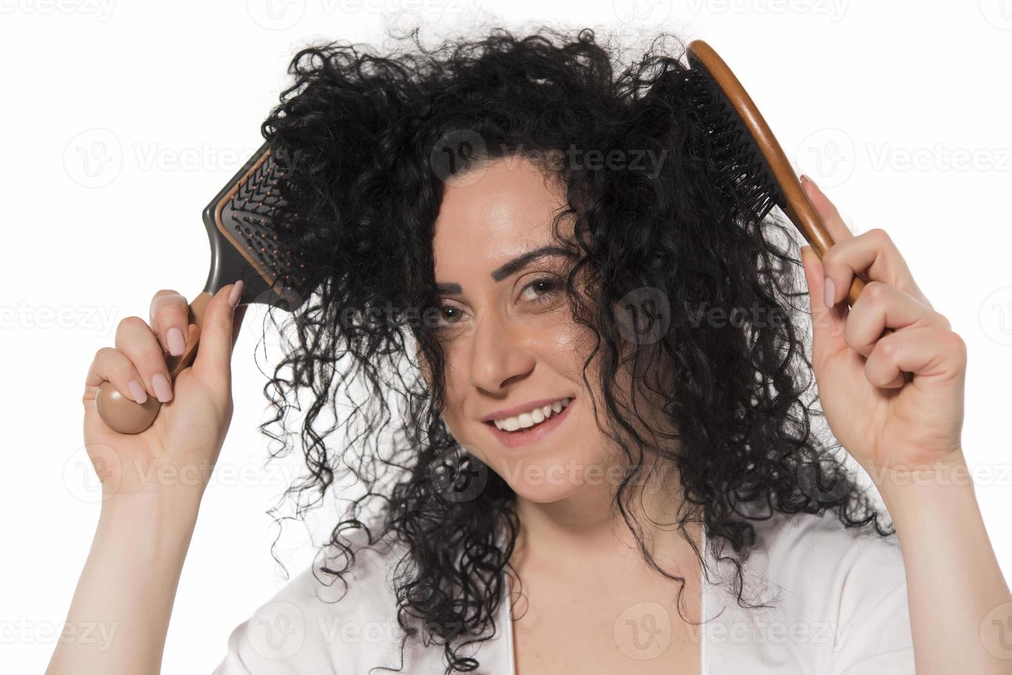 beautiful female with comb stuck in curly hair 15975028 Stock Photo at