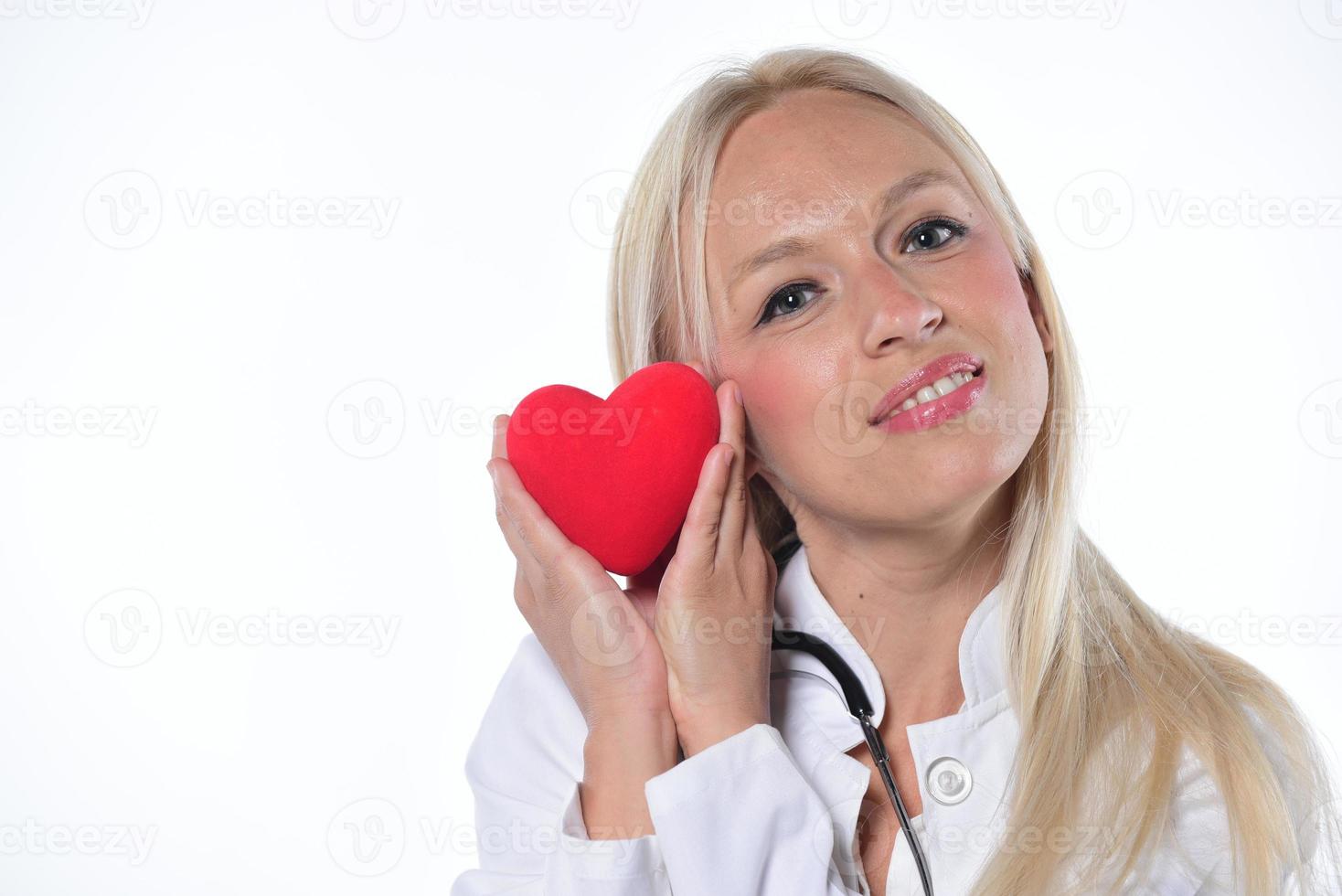 cardio heart surgeon hands holding red heart shape on white background photo