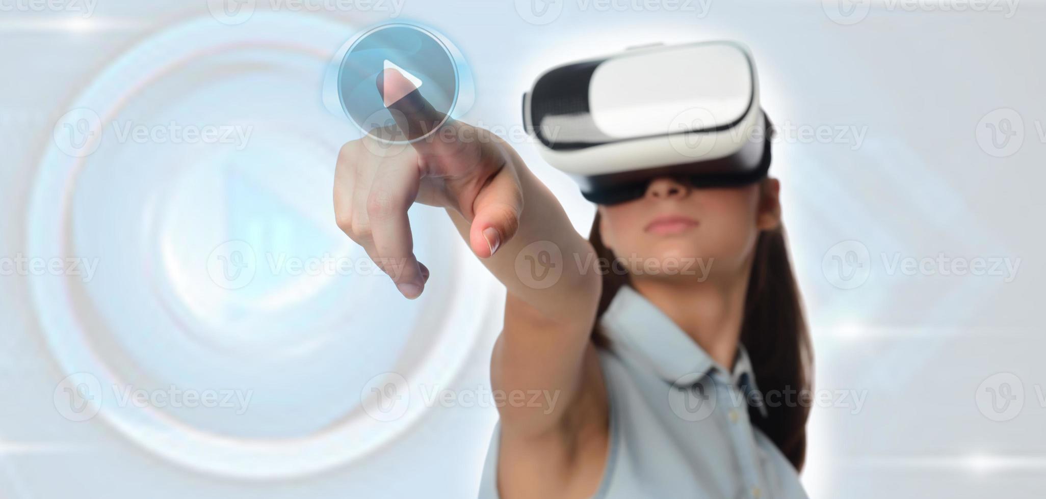 Young woman in virtual reality VR glasses. photo