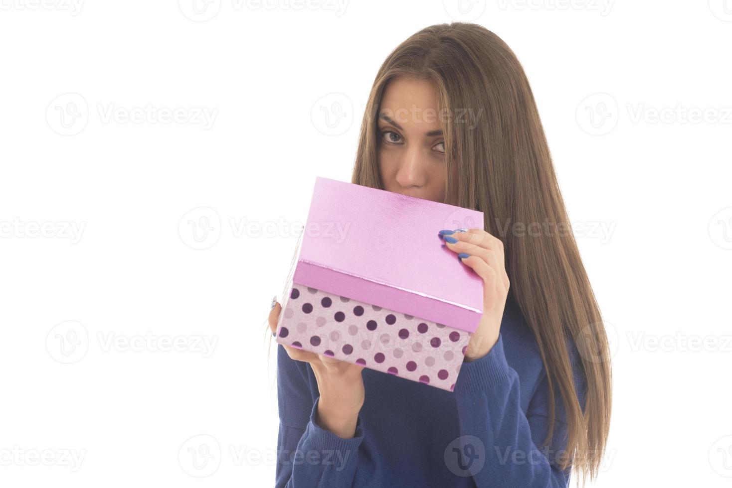 Beautiful woman holding big gift box photo