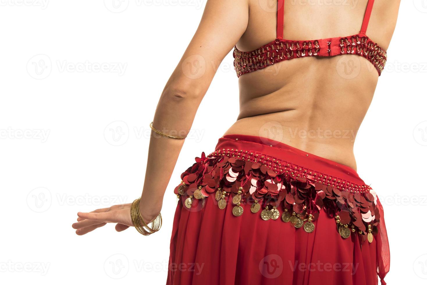 Beautiful belly dancer young woman in gorgeous red and black costume dress photo