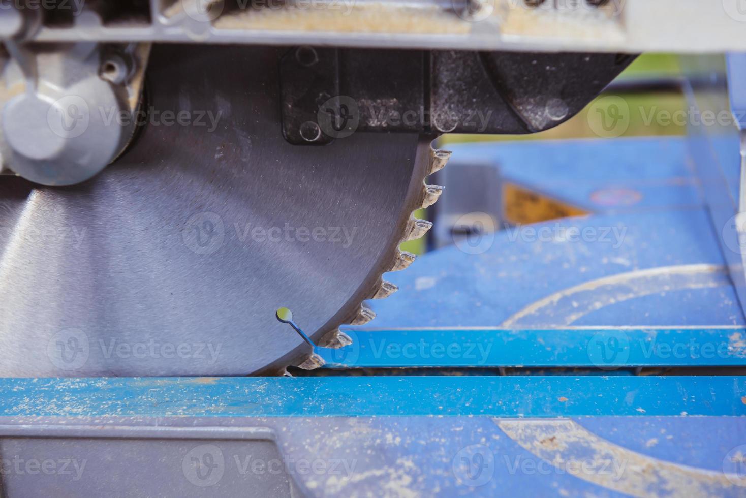 unknown construction worker using with circular saw and plank. construction concept photo