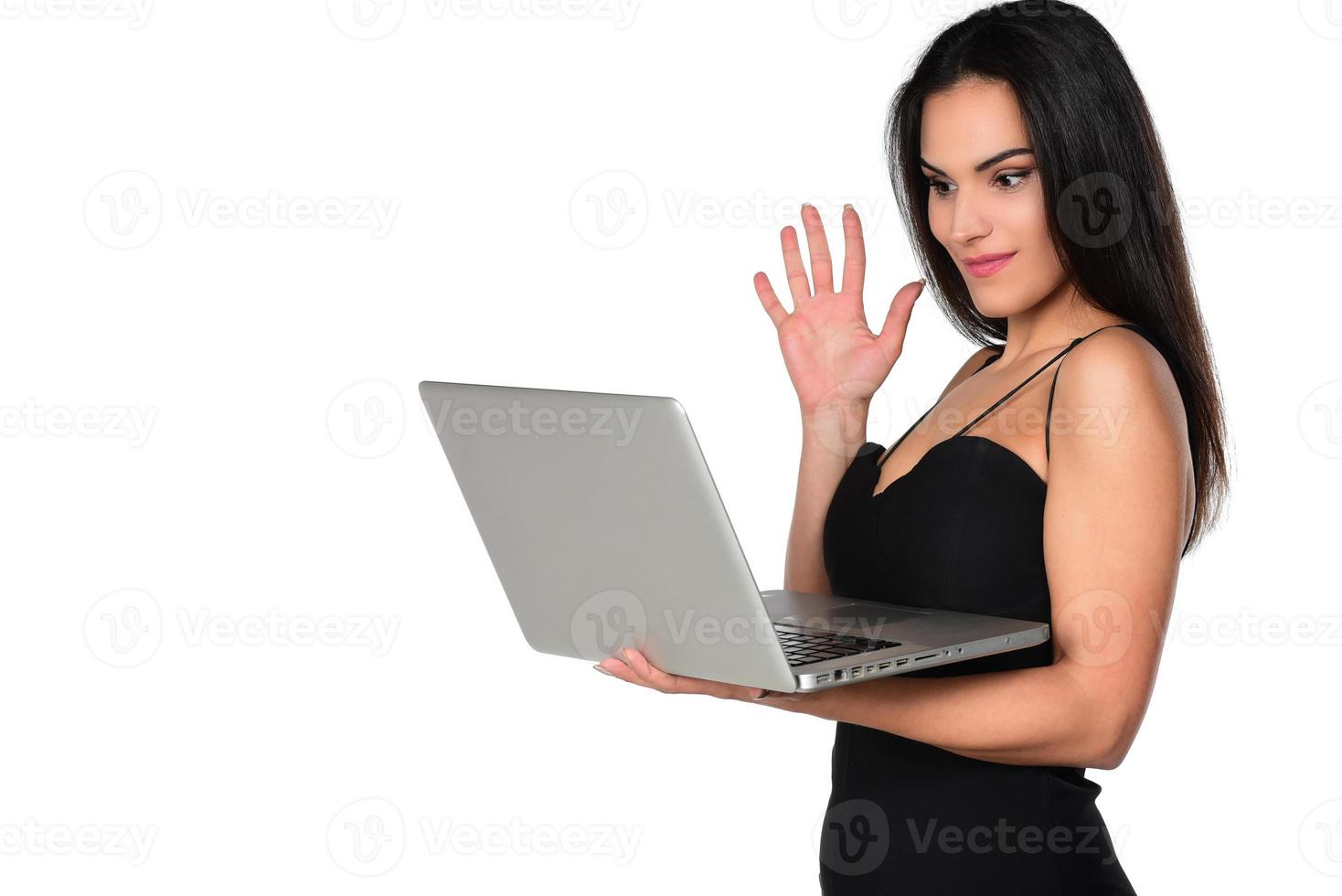 beautiful smiling woman holding laptop computer photo