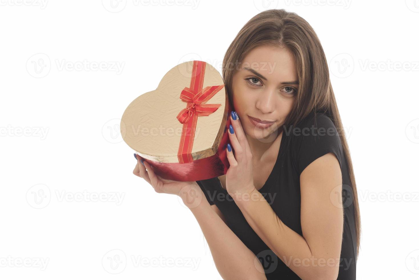 Beautiful woman holding big gift box photo