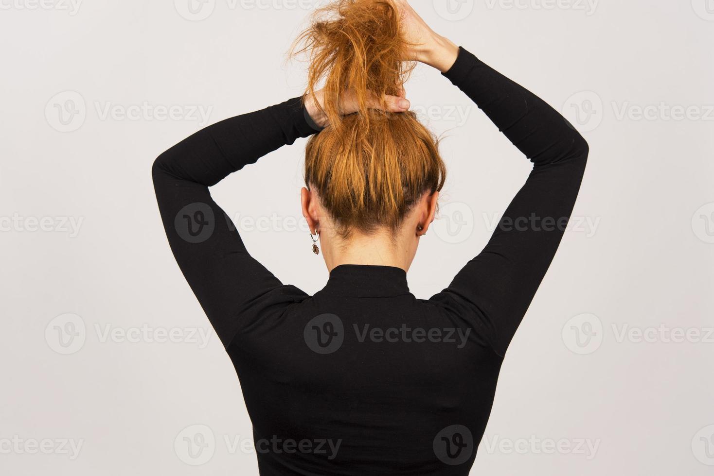 back view Portrait of young woman tied her hair photo