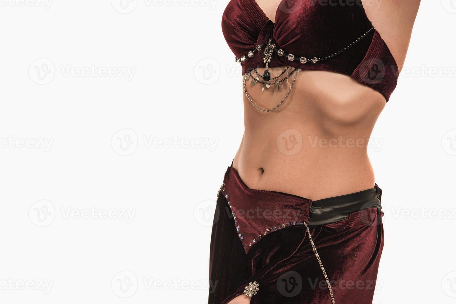 Beautiful belly dancer young woman in gorgeous red and black costume dress photo