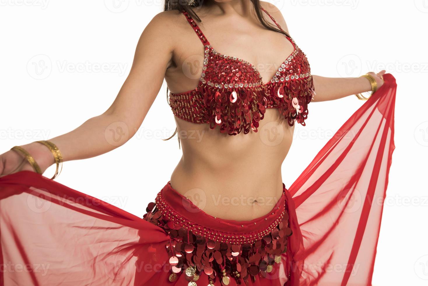 Beautiful belly dancer young woman in gorgeous red and black costume dress photo