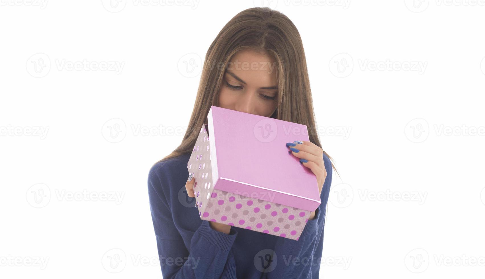 Beautiful woman holding big gift box photo