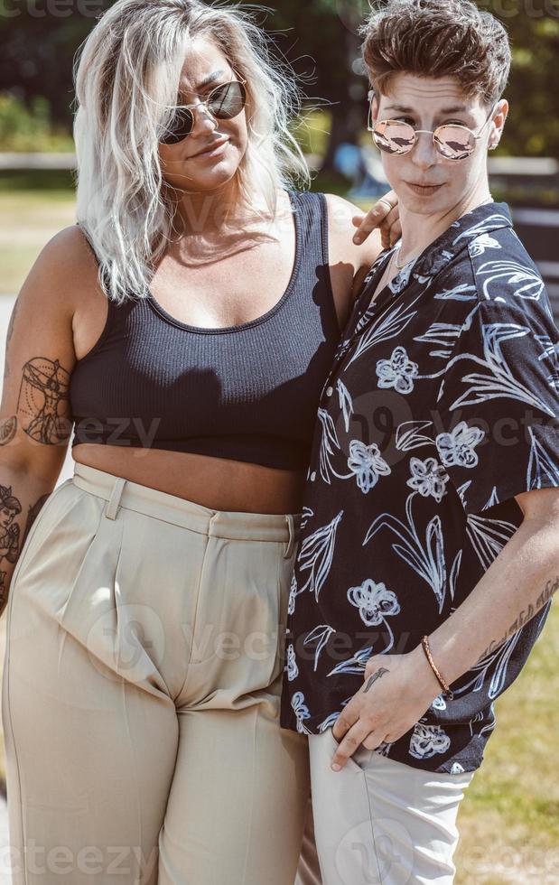 Same sex young married female couple in their daily routine showing some affection LGBT photo