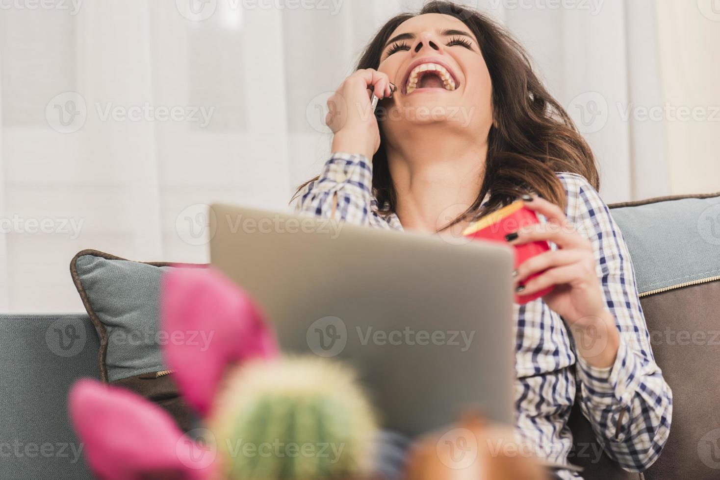 woman in front of a laptop preparing home finance photo