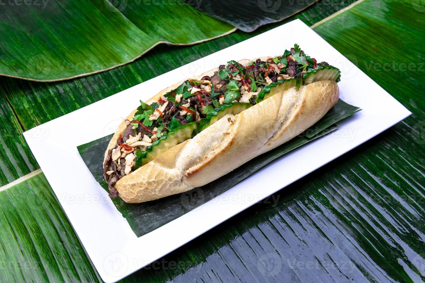 Vietnamese Food. Tasty Vietnamese food served on the top of a banana leaf. photo