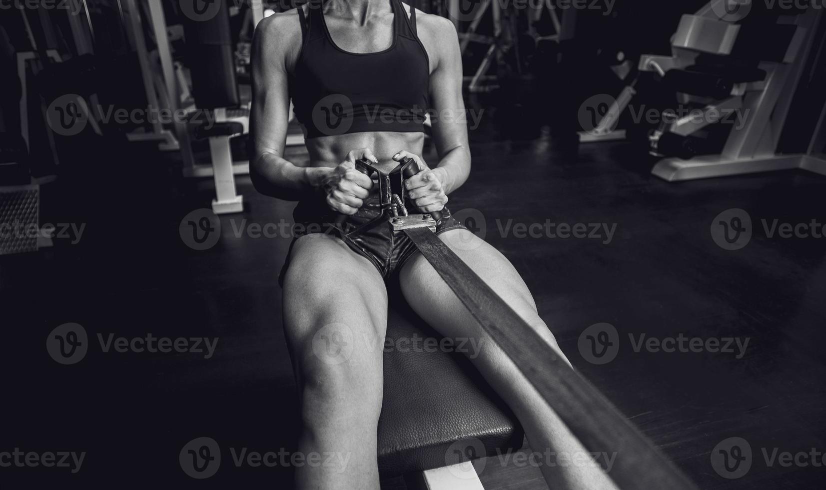 Woman doing a workout at the fitness gym. photo