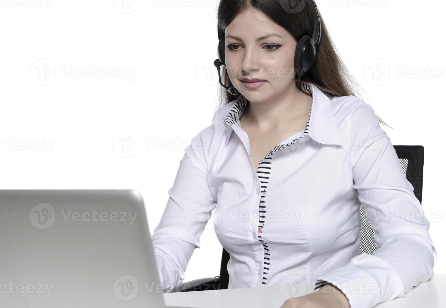 beautiful female model working on a laptop photo