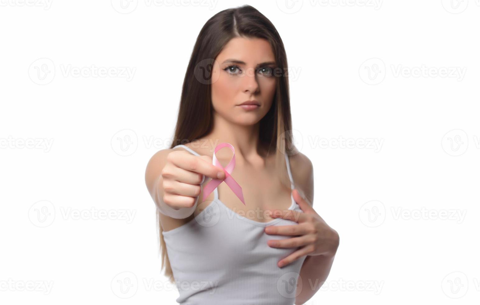 healthcare and medicine concept. Woman hand holding pink breast cancer awareness ribbon. photo