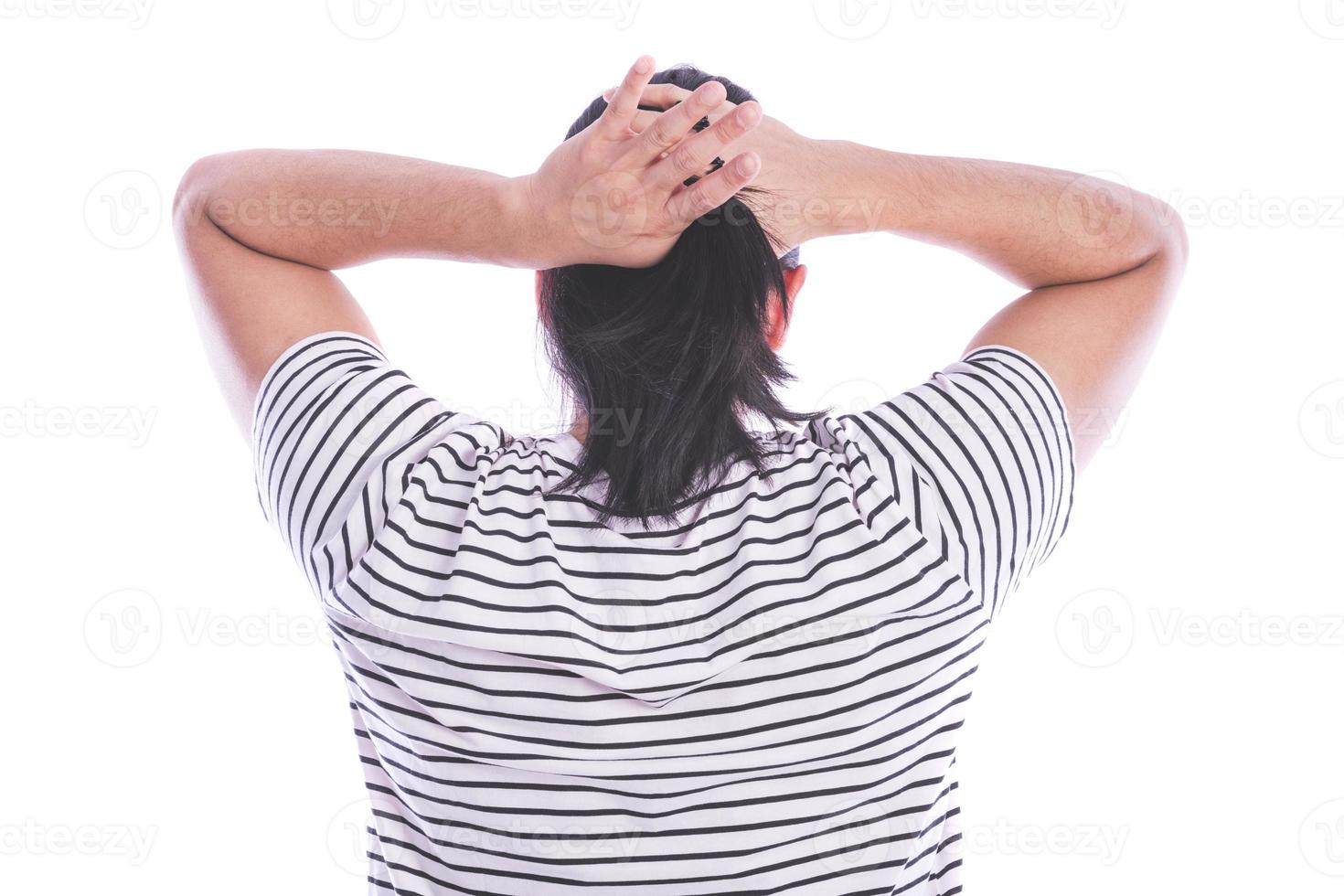 ack view of a man with long hair making ponytail. photo