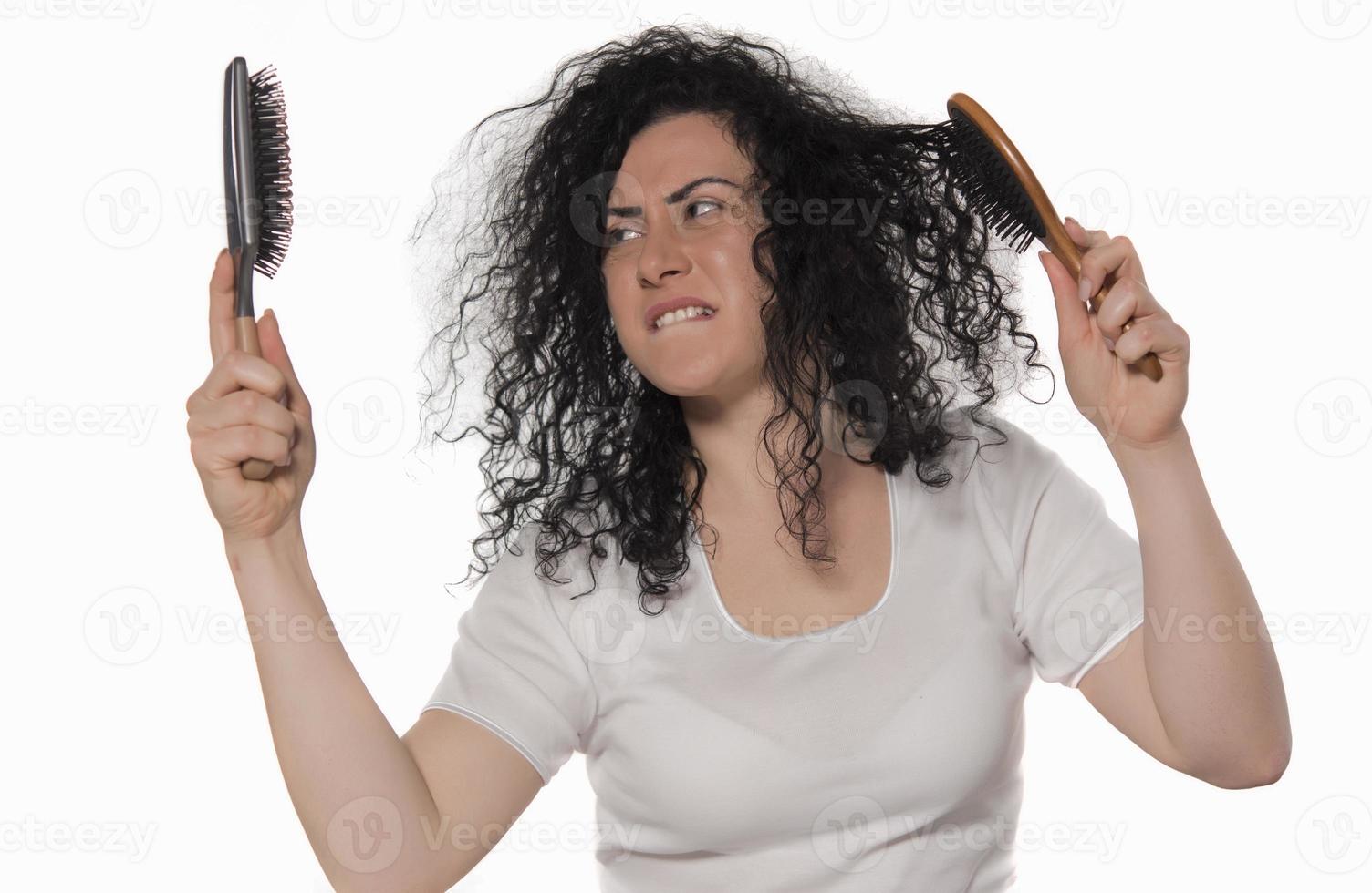 beautiful female with comb stuck in curly hair 15977858 Stock Photo at