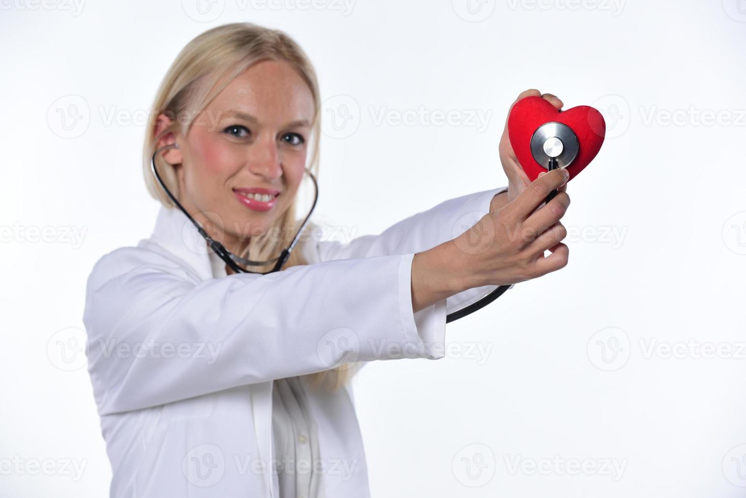 cardio heart surgeon hands holding red heart shape on white background photo