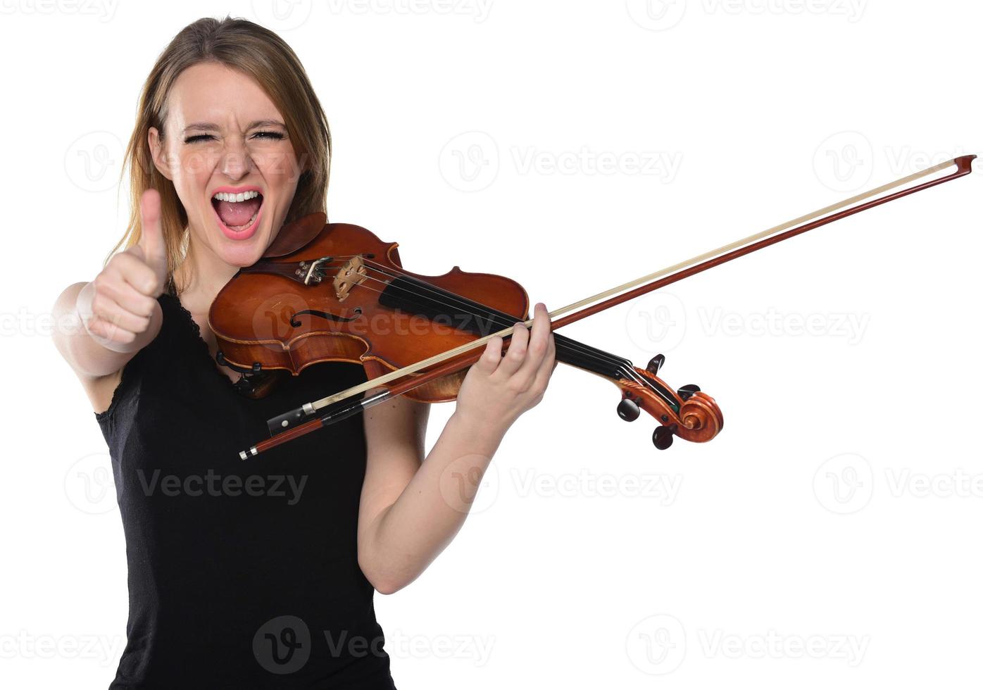 Beautiful natural blond girl holding and playing violin. photo