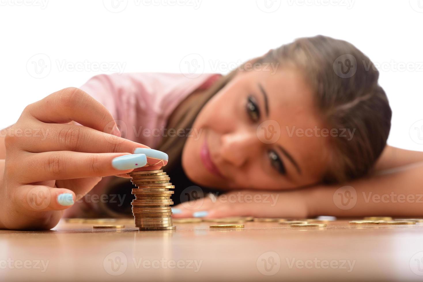 Young brunette women collecting metal money. savings finance concept photo