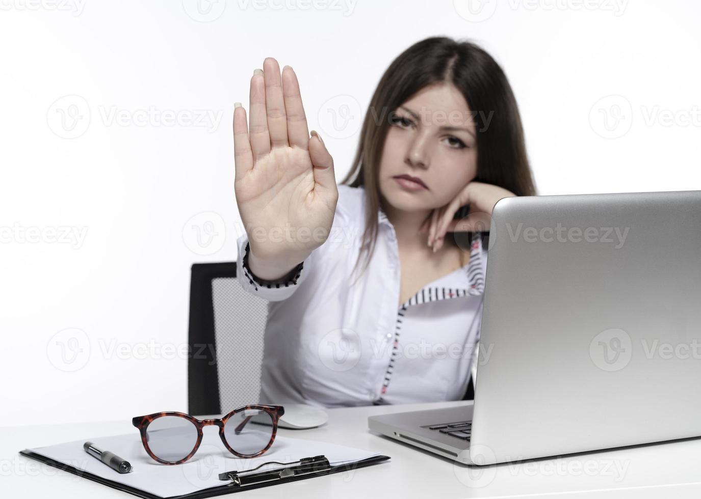 beautiful female model working on a laptop photo