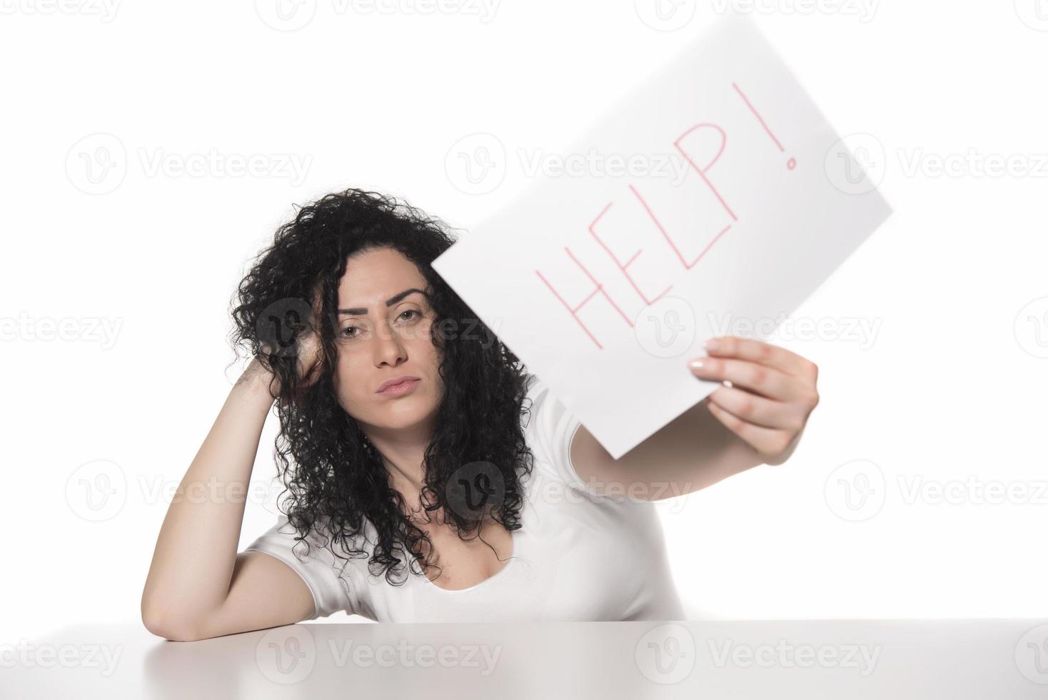 woman holding HELP sign. photo