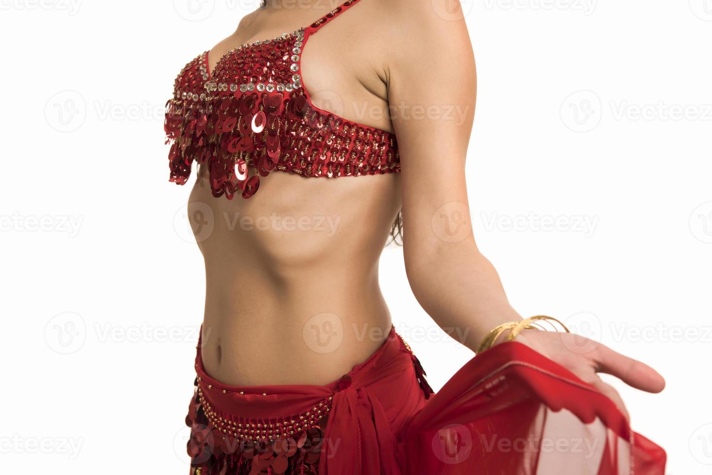 Beautiful belly dancer young woman in gorgeous red and black costume dress photo