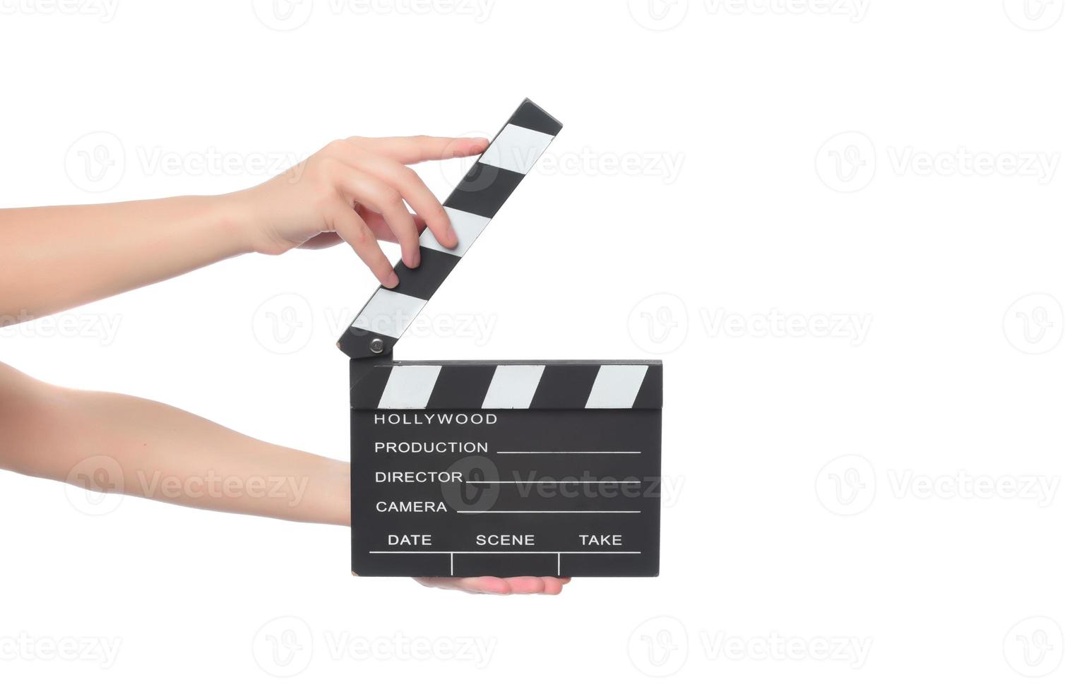 beautiful young woman with cinema clapper posing in studio. Movie concept. isolated photo