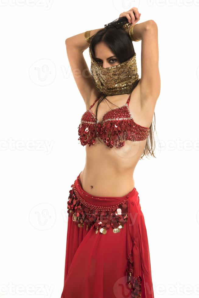 Beautiful belly dancer young woman in gorgeous red and black costume dress photo