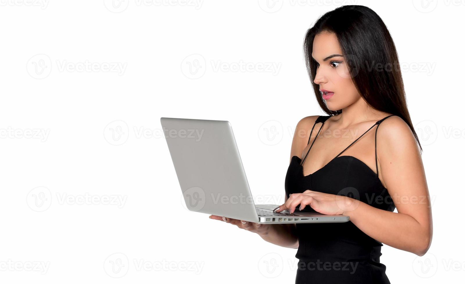beautiful smiling woman holding laptop computer photo