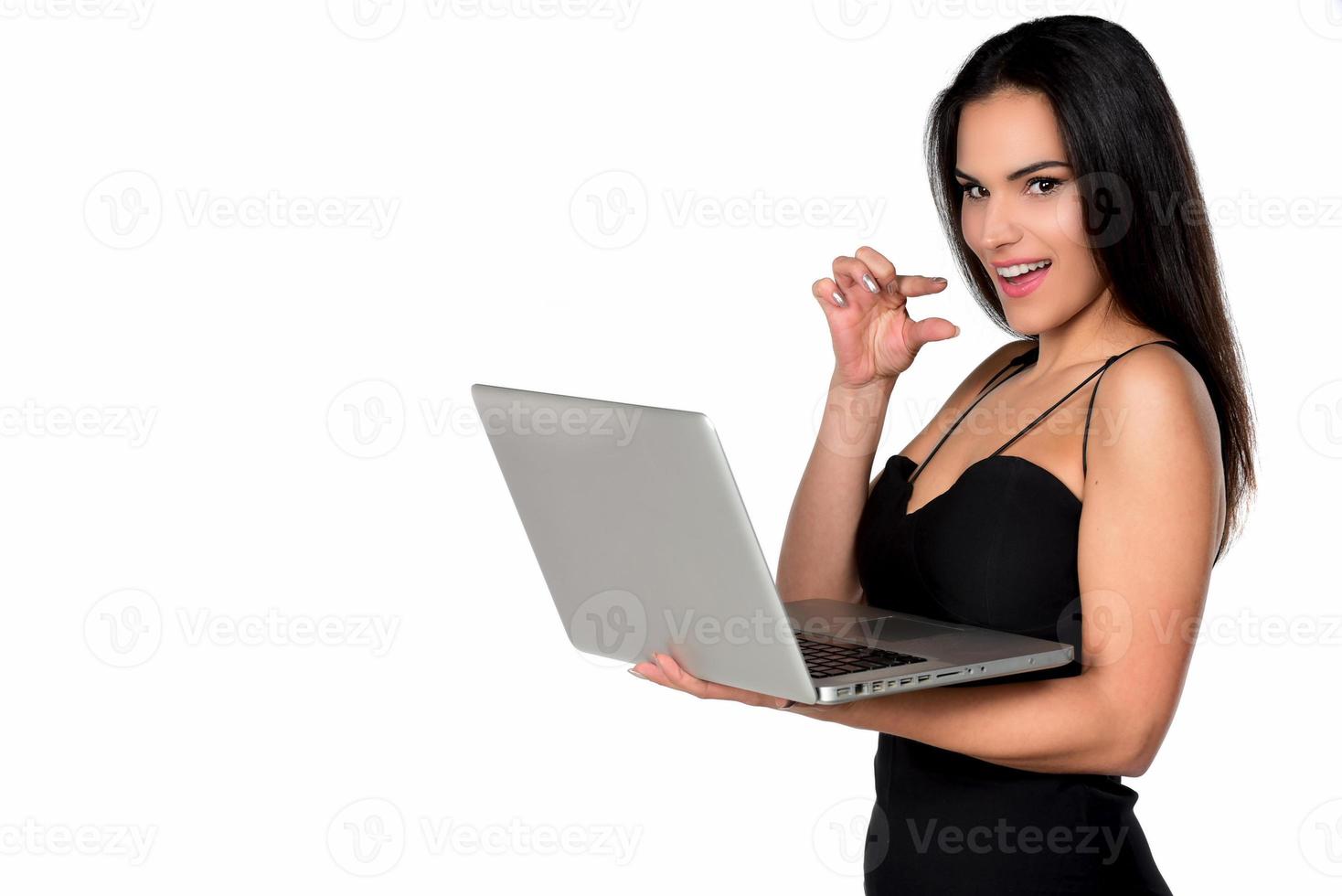 beautiful smiling woman holding laptop computer photo