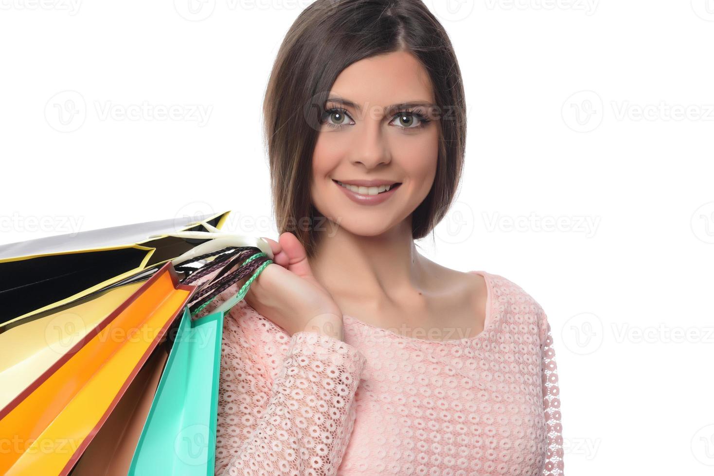 shopping, sale, gifts, concept - smiling woman with colorful shopping bags photo