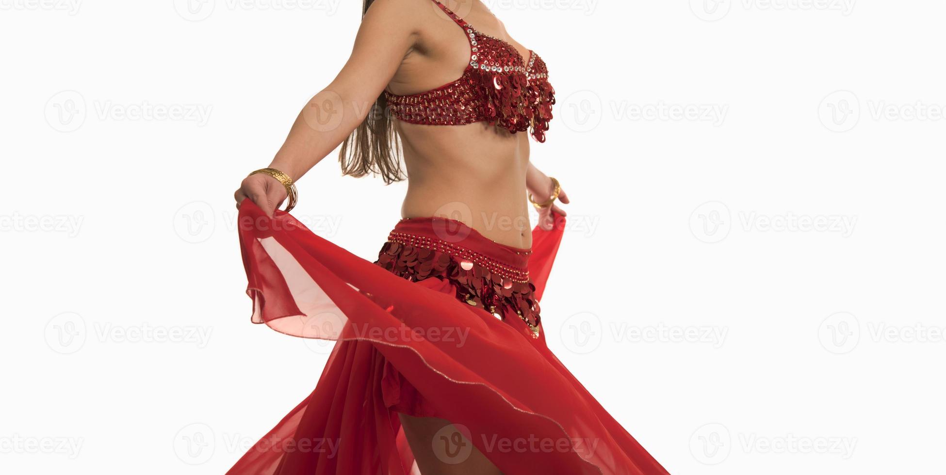 Beautiful belly dancer young woman in gorgeous red and black costume dress photo