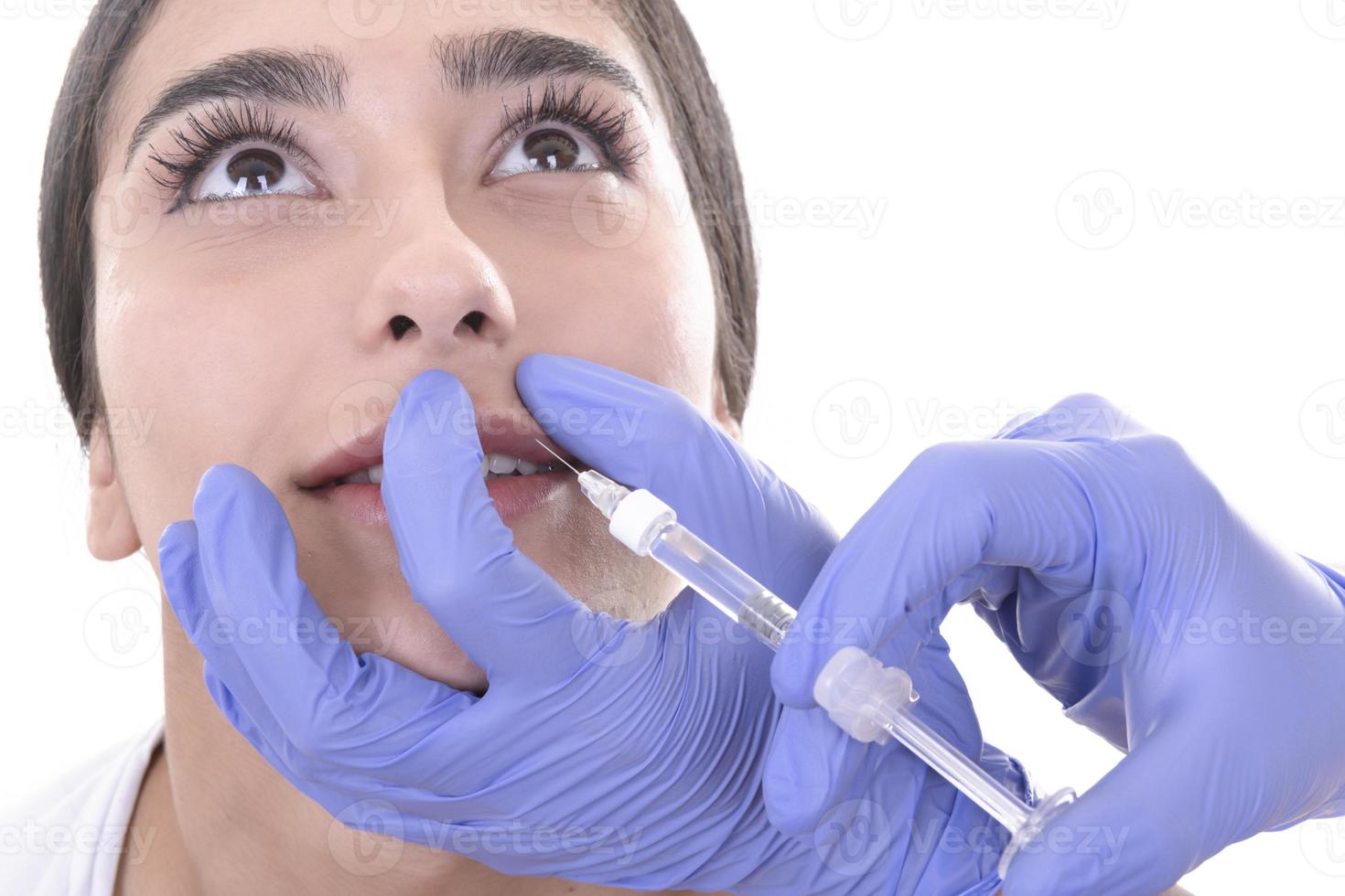 young woman gets injection of botox. anti-aging injection photo