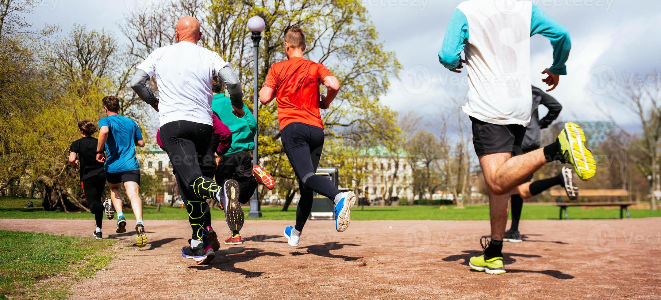 unknown people running in the park. jogging concept photo