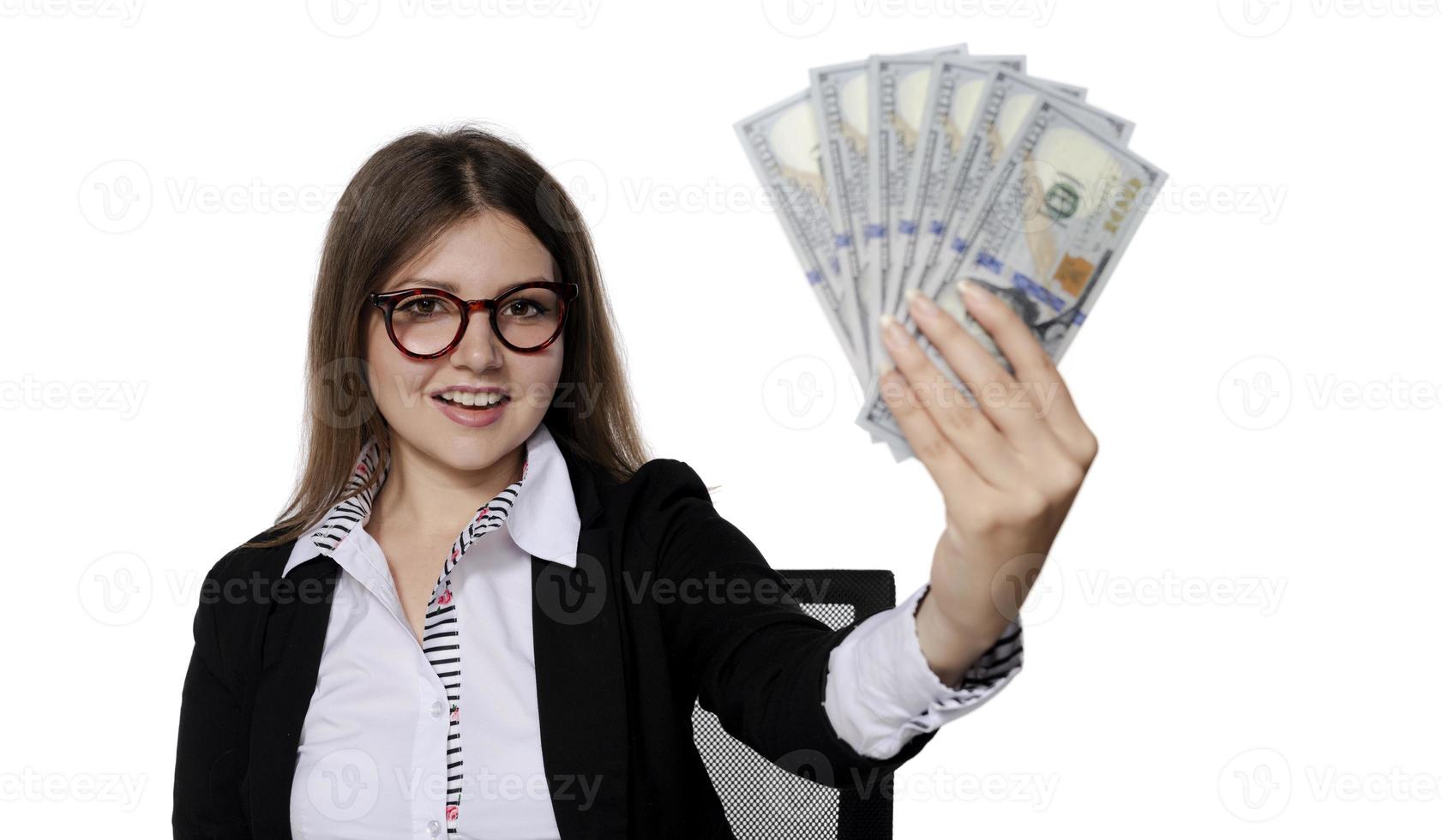 woman holding American dollars in her hand. isolated photo