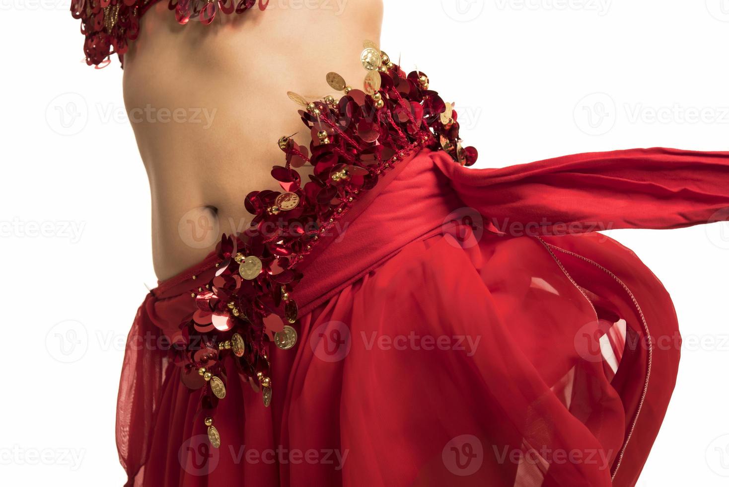 Beautiful belly dancer young woman in gorgeous red and black costume dress photo