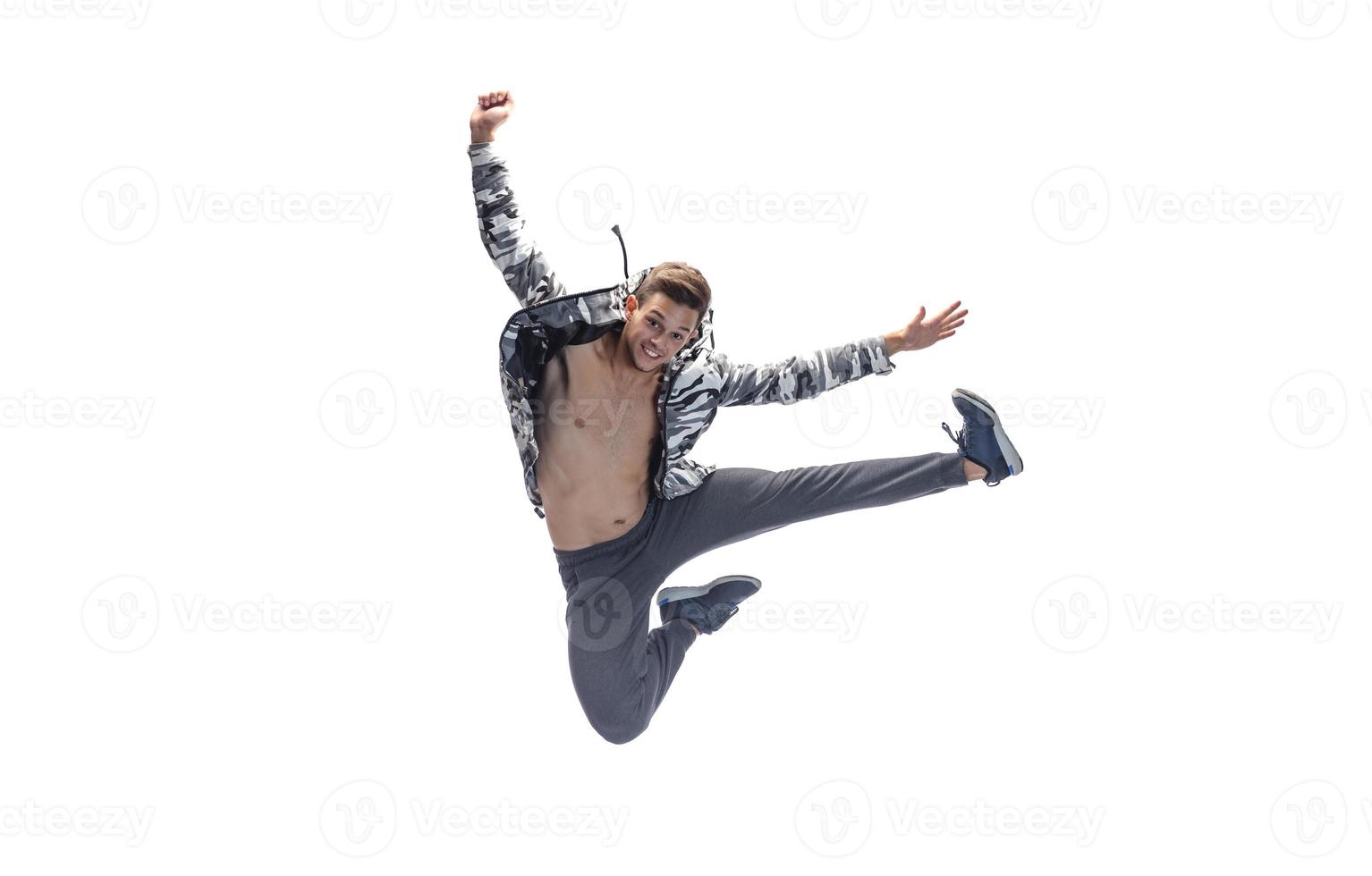 male model doing break dance routine. isolated on white background photo