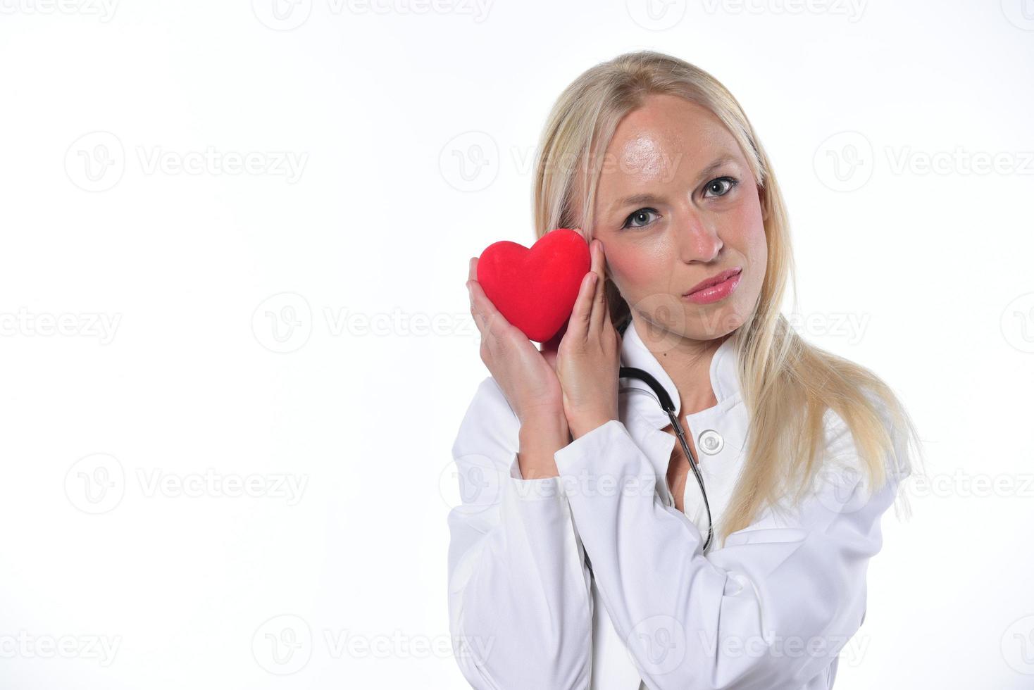 cardio heart surgeon hands holding red heart shape on white background photo