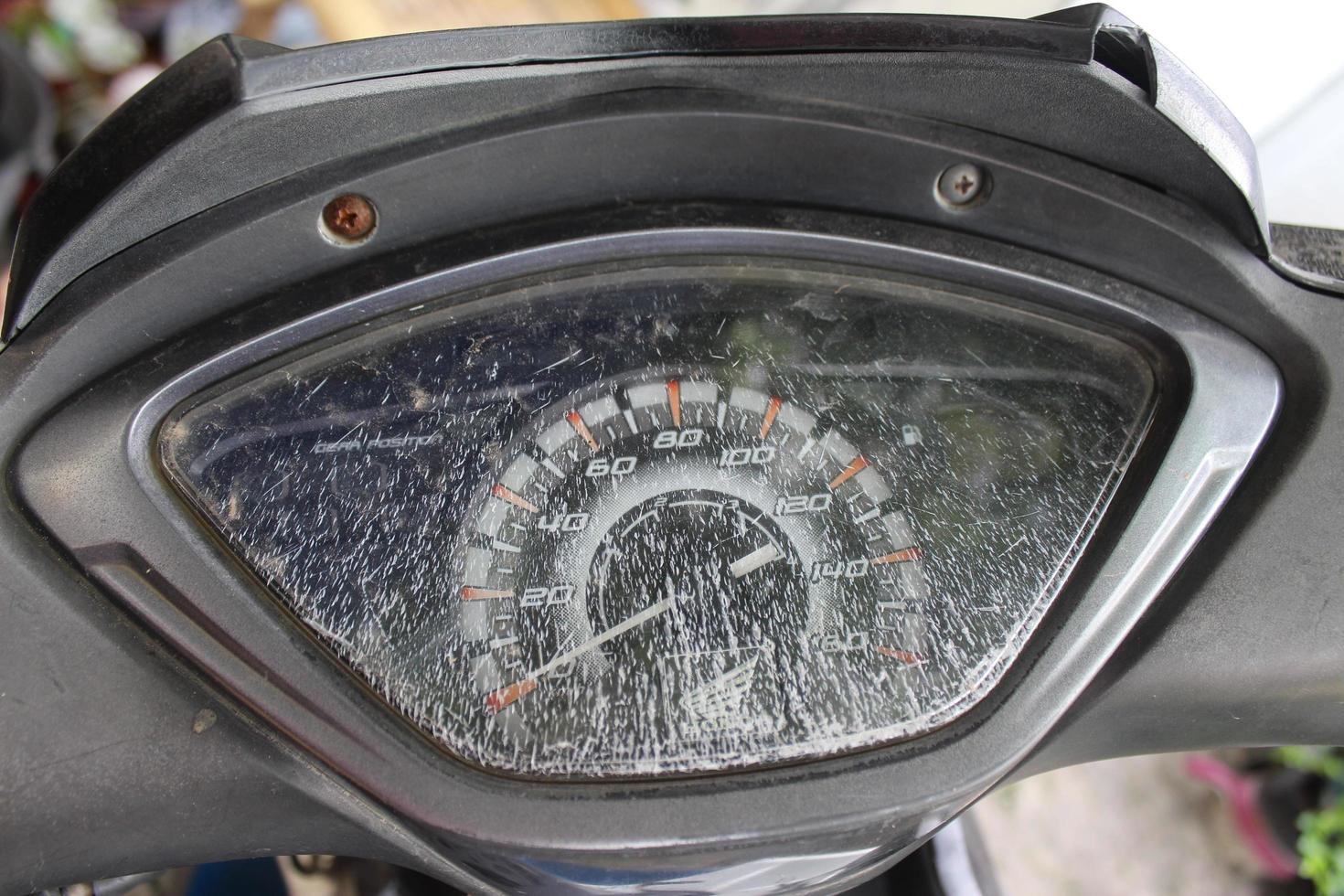 Cilegon, Banten, Indonesia November 20 2020 Close-up of broken speedometer cover glass on a Honda motorbike photo