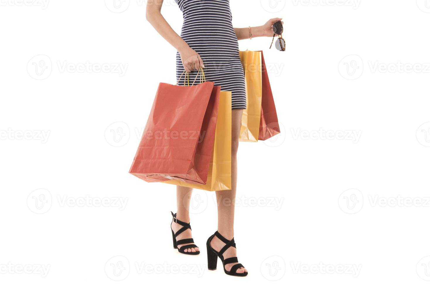 Young Modern Beautiful woman holding a lot of shopping bags photo