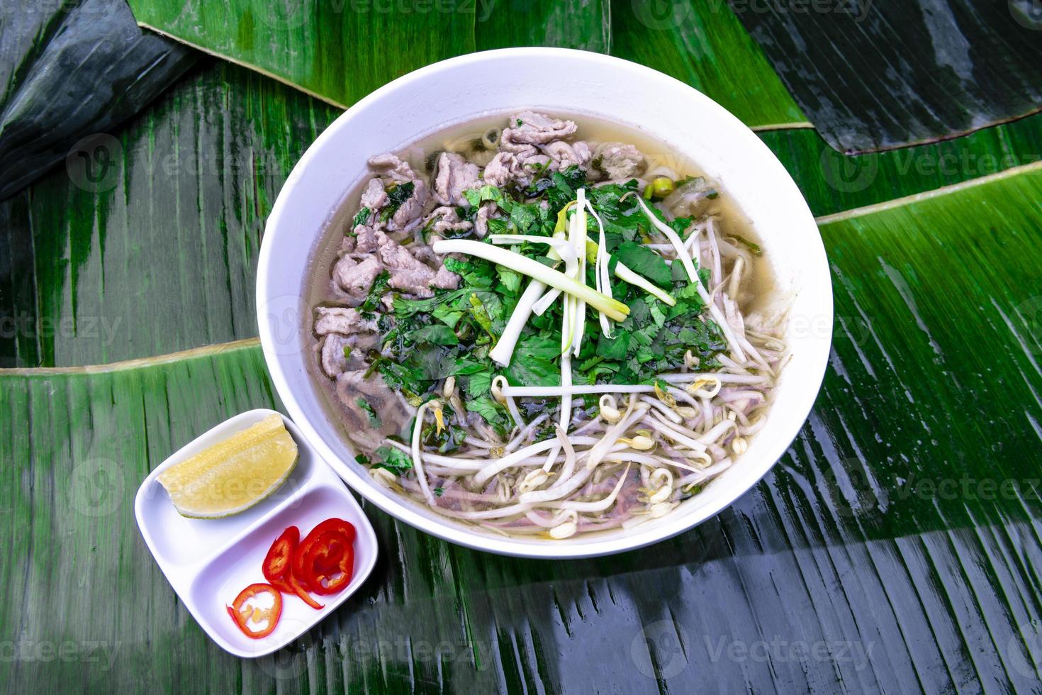 Vietnamese Food. Tasty Vietnamese food served on the top of a banana leaf. photo