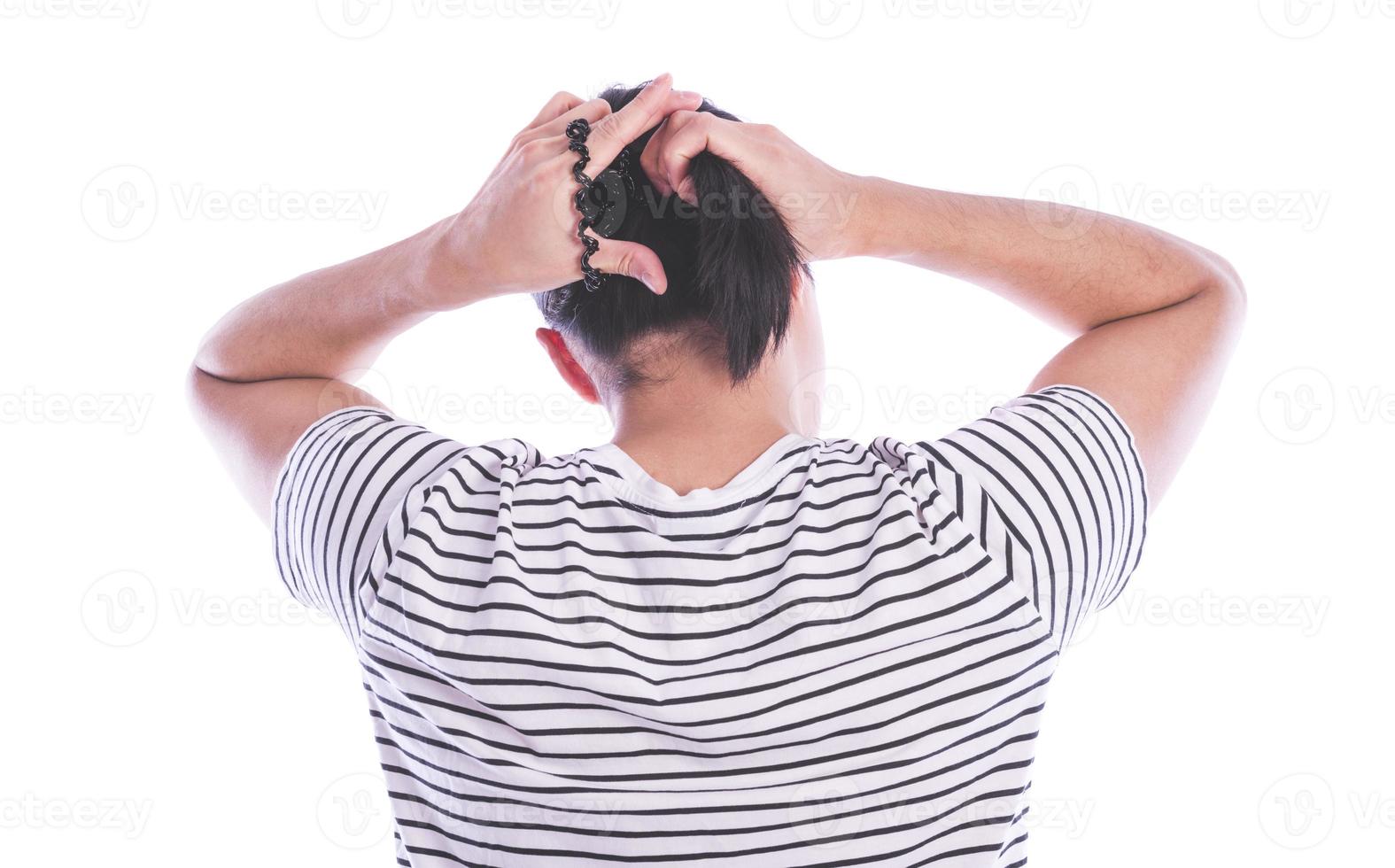 back view of a man with long hair making ponytail photo