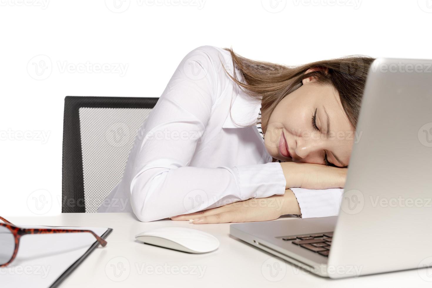 beautiful female model working on a laptop photo