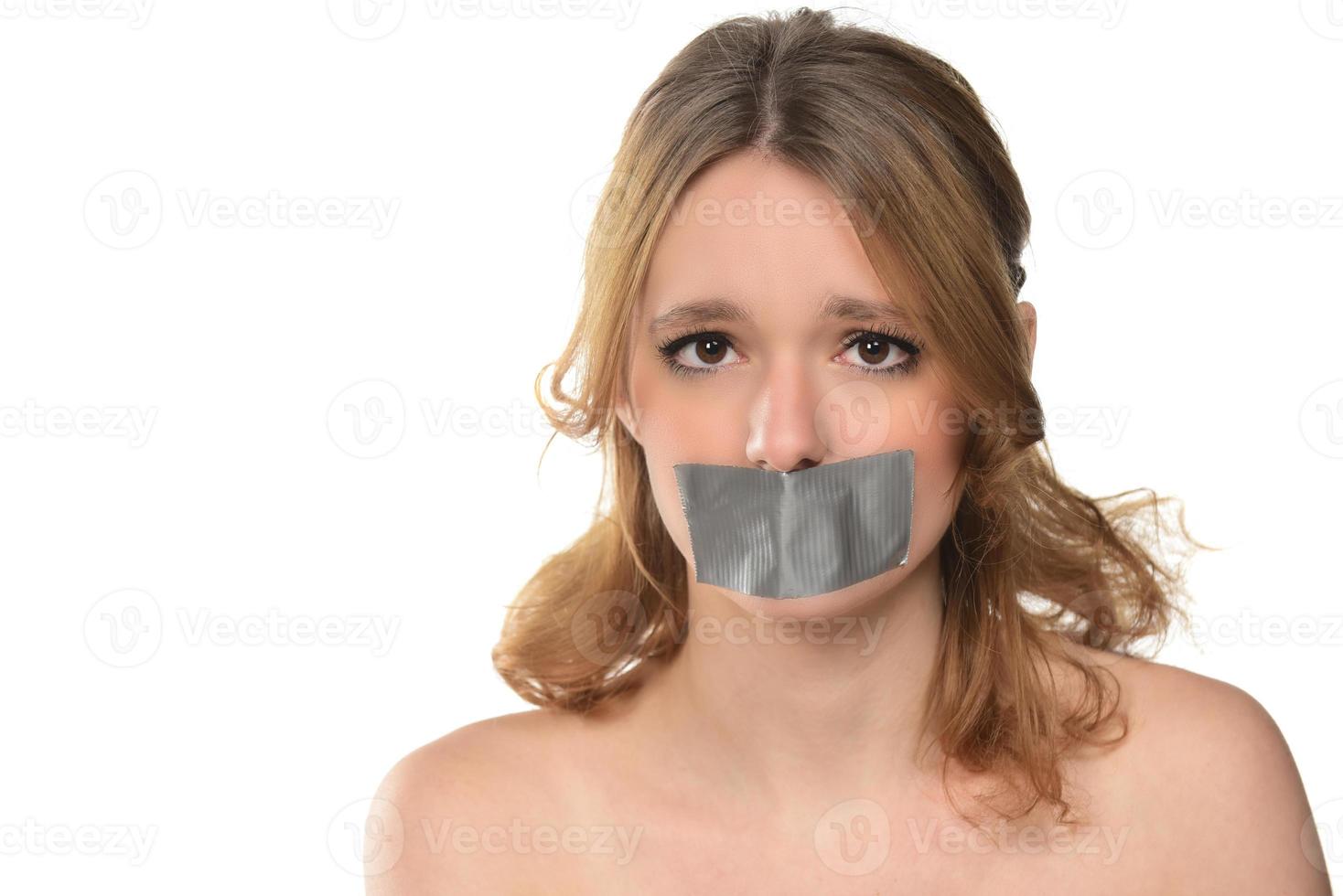 scared young woman with tape over her mouth. 15988097 Stock Photo at Vecteezy
