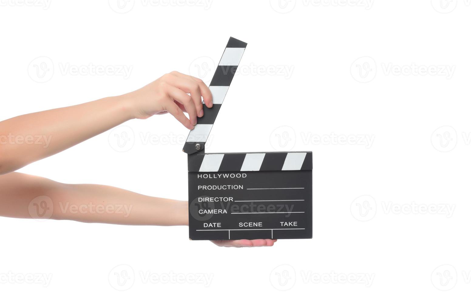 beautiful young woman with cinema clapper posing in studio. Movie concept. isolated photo